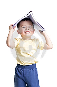 Preschooler child with a book over his head