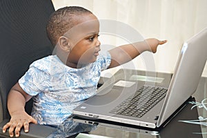 Preschooler e-learning online at home with a laptop