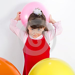 Preschooler girl with air balloons