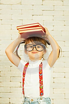 Preschooler girl with books