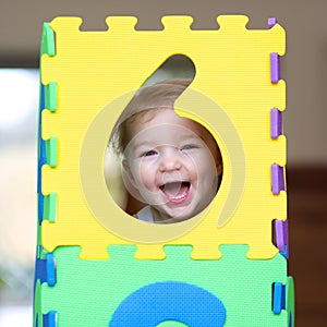 Preschooler girl playing with puzzles learning numbers