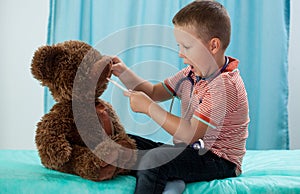 Preschooler and his teddy bear photo