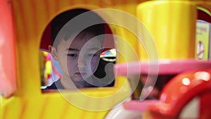 Preschooler playing on amusement park and slot machines