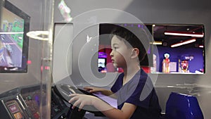 Preschooler playing on amusement park and slot machines