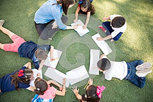 Preschoolers taking a class outdoors