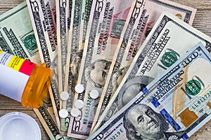 Prescription drugs in the USA are expensive, concept, Rx on US dollars, flat lay