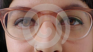 Prescription glasses for vision and eyesight. Closeup of a woman wearing spectacles during a visit to the optometrist