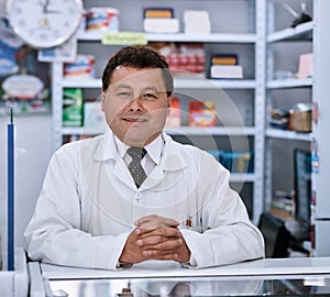 Prescription needs come to me. Portrait of a male pharmacist in a pharmacy.