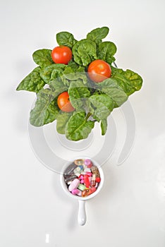 Prescription Pills and Medicine Medication Drugs versus Spinach Salad