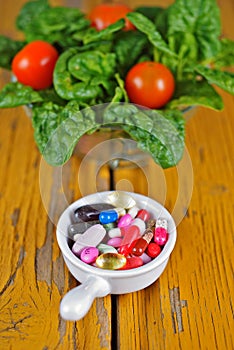 Prescription Pills and Medicine Medication Drugs versus Spinach Salad
