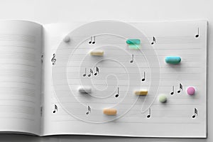 Prescription pills on music paper