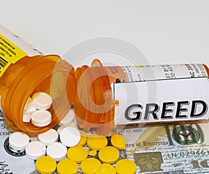 Prescription pills spill out of bottles on to money with greed written on one bottle