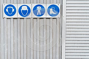 Prescriptive safety signs and posters of personal protective equipment at work