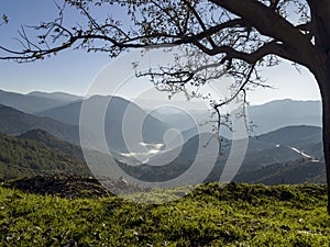 the presence of fog clouds in the valley and the wonderful mountain ranges