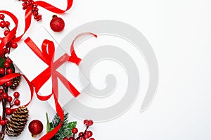 Present box, berries and pinecones top view background. Christmas gift. Festive backdrop with copyspace. Xmas composition with