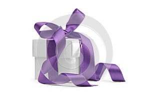 Present box with purple ribbon photo