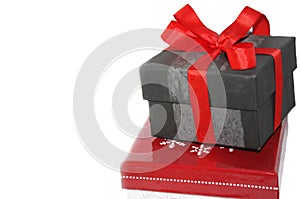 Present box with red ribbon and bow, christmas gift isolated on white