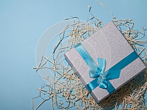 Present boxes on blue background greeting card holidays concept. empty space for text