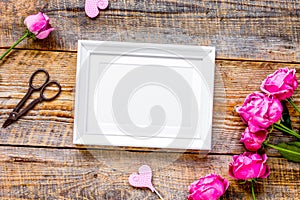 Present design with peony bouquet and white frame top view mock up