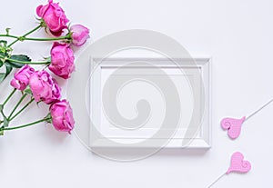 Present design with peony bouquet and white frame top view mock up