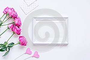 Present design with peony bouquet and white frame top view mock up