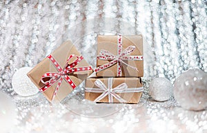 Present or gift box against bokeh background. Holiday greeting card on Birthday or Christmas.