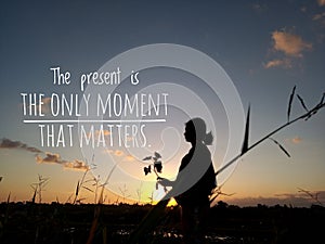 The present is the only moment that matters, silhouette image with text quote words of wisdom