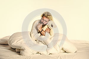 Present for partner. Toys shop concept. playing in bed. mature man has childish habits. cute and romantic playful adult