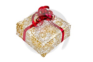 Present wrapped in gold-white paper with a red ribbon