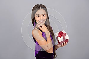 Present you will admire. Happy girl hold present box. Birthday gift