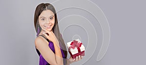 Present you will admire. Happy girl hold present box. Birthday gift. Kid girl with gift, horizontal poster. Banner