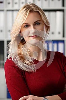 Presentable office worker smiling and posing for picture with crossed arms