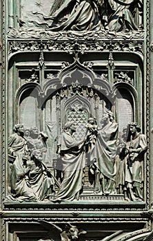 The presentation of Jesus at the temple, detail of the main bronze door of the Milan Cathedral photo