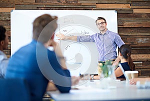 Presentation whiteboard, teamwork and business man speech, discussion or collaboration on pie chart. Strategy meeting