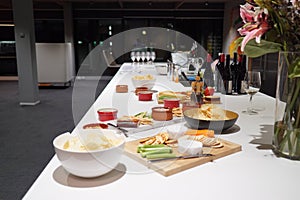 A cheese platter accompanied with wine with a view