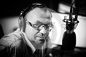 Presenter or host in radio station hosting show for radio live in Studio