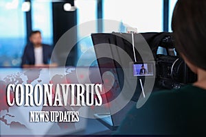 Presenter and video camera operator working. Coronavirus pandemic - latest updates