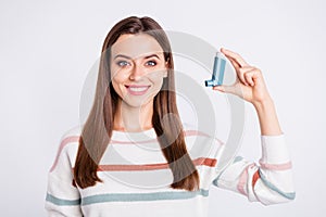 Presenting bronchospasm cartridge aerosol lady wear striped pullover isolated white background photo