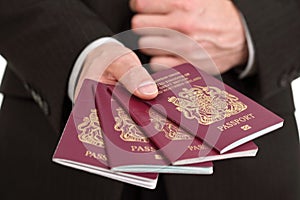 Presenting four British passports at the airport