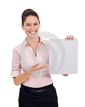 Presenting your message. Studio portrait of an attractive young woman holding up a blank sign isolated on white.