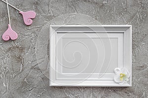 Presents set for baby shower with frame gray stone background top view mockup
