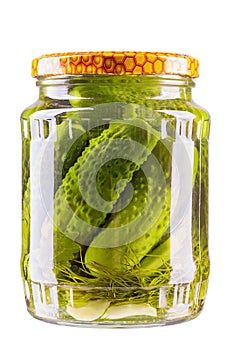 Preservation, conservation. Salted, pickled cucumbers in a jar isolated on white background. Canned vegetables.