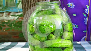 Preservation of cucumber vegetables in a glass jar.