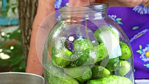 Preservation of cucumber vegetables in a glass jar.