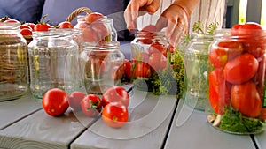 Preservation tomatoes in jars. Selective focus.