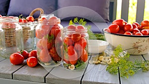 Preservation tomatoes in jars. Selective focus.