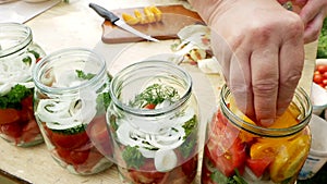 Preservations, conservation Salted pickled tomatoes in a jars on an wooden table