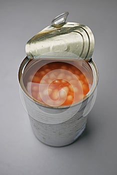 preserved canned tomato beans on table