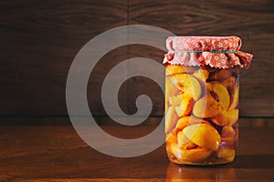 Preserved fruit in jar, compote of peaches