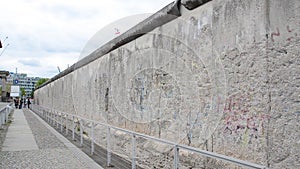 Preserved section of the Berlin Wall. The Berlin Wall was concrete barrier separating Berlin into east and west during cold war.